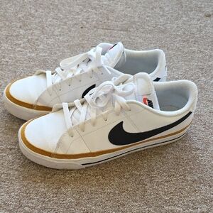 Nike Men's White and Black Sneakers with Gold Trim